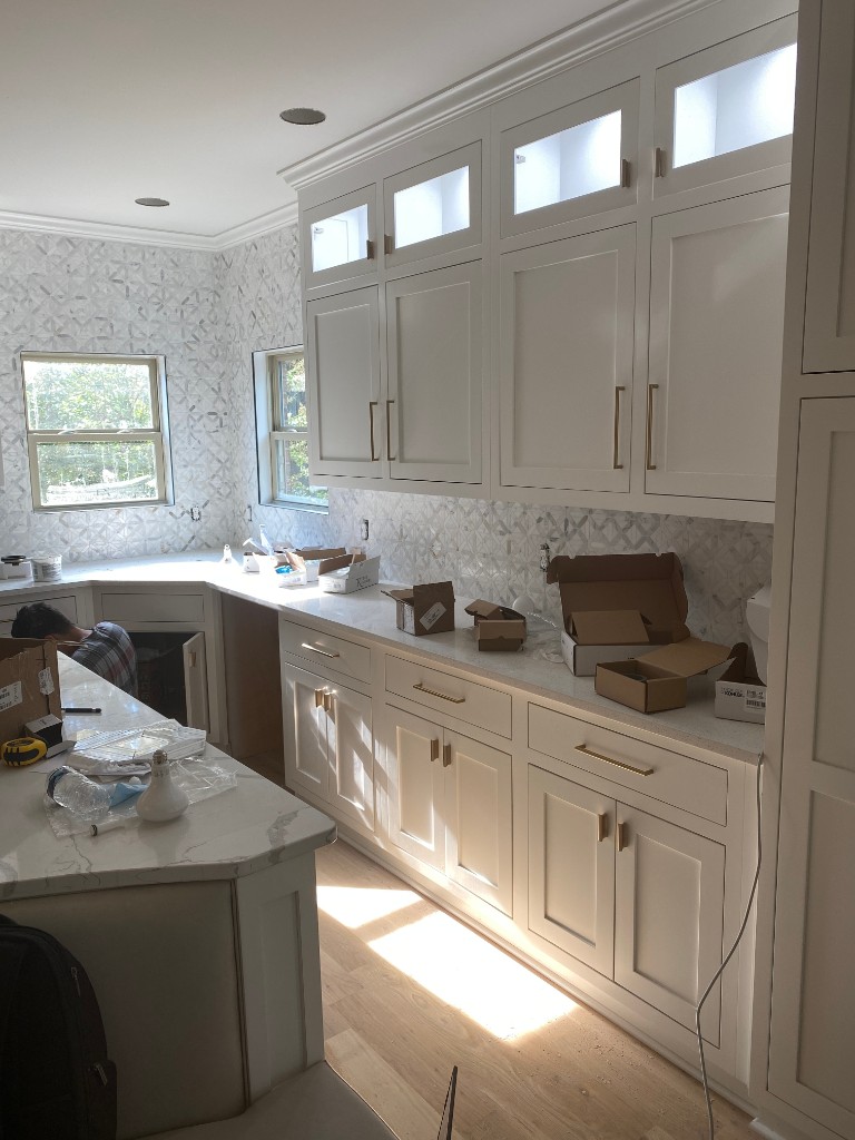 White shaker kitchen cabinets in progress