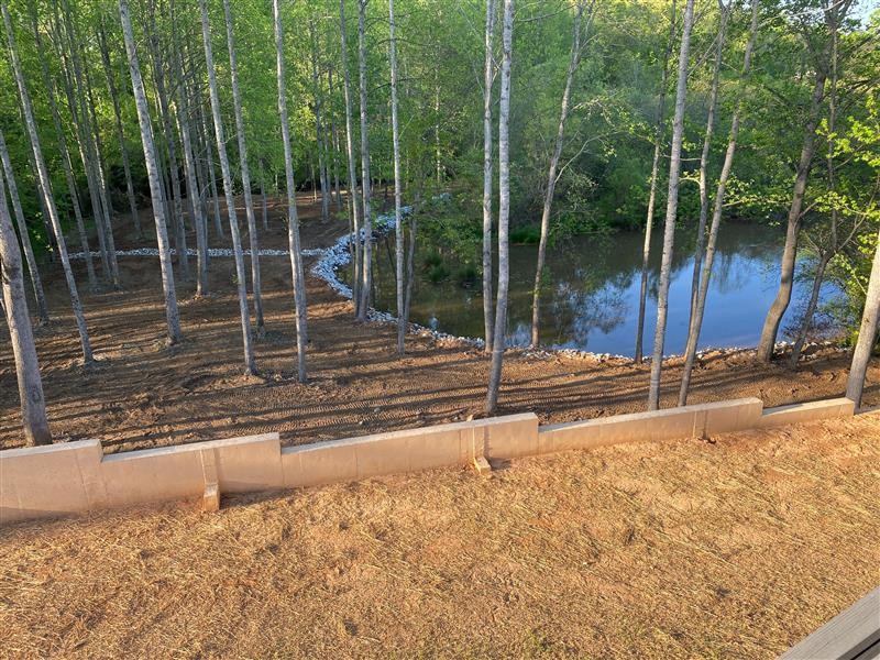 Retaining wall and pond landscaping