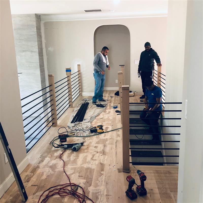 Stair railing installation in progress
